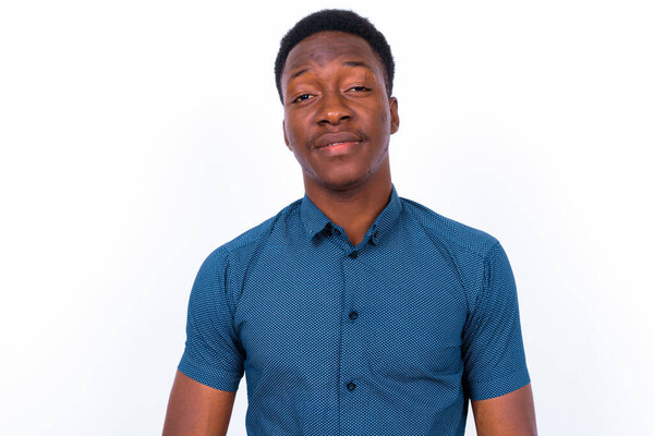 Studio shot of young handsome African man against white background