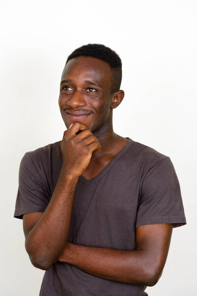 Studio shot of young African man isolated against white background
