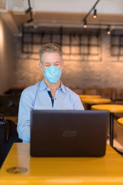 Portrait Mature Businessman Mask Protection Corona Virus Outbreak Sitting Coffee — Stock Fotó