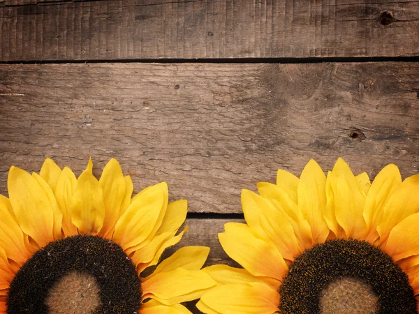 Sunflowers on old wood — Stock Photo, Image