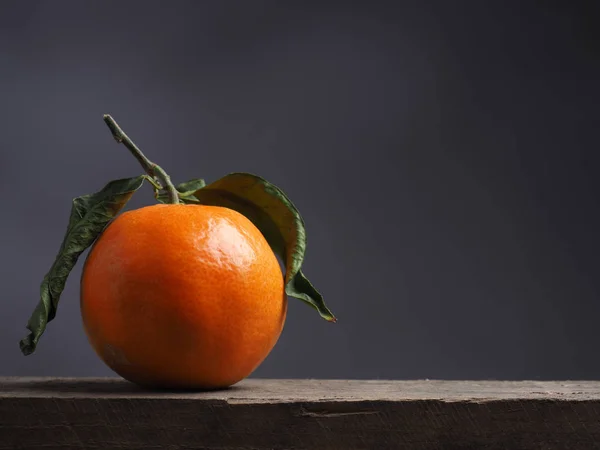 Fresh orange fruit on a table — Stock Photo, Image