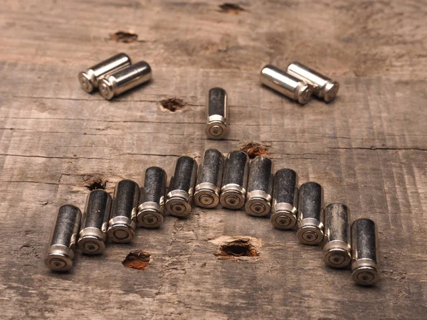 Bullets on a wooden table — Stock Photo, Image