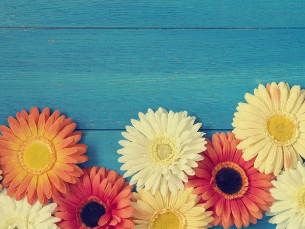 Colorful flower decoration on wood — Stock Photo, Image