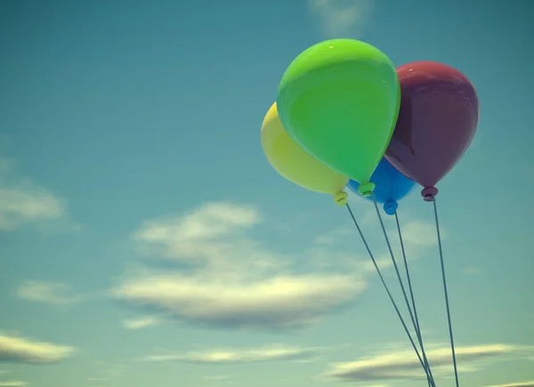 Four colorful balloons on summer sky — Stock Photo, Image