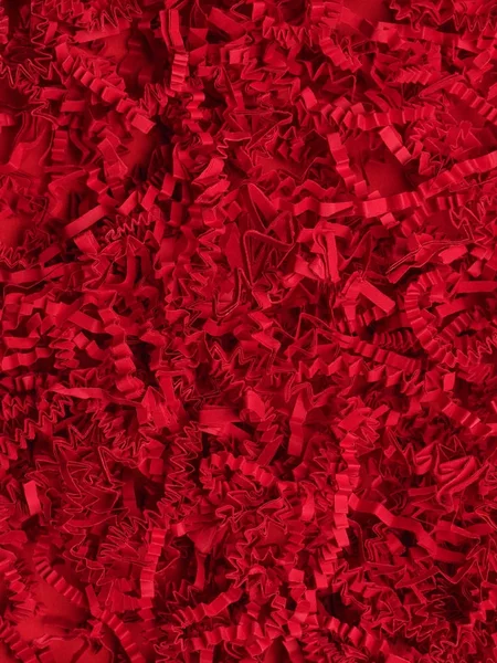 Abstract red texture of shredded paper — Stock Photo, Image