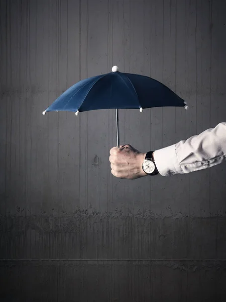 Businessman with an umbrella — Stock Photo, Image