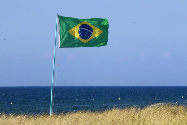 Brasil flag by the sea — Stock Photo, Image