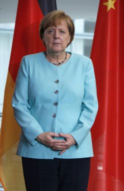 Angela Merkel concentrates on a perfect presentation of her 