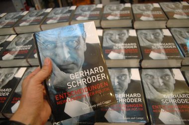 Freshly printed copies of the Meoiren by ex-Chancellor Gerhard Schroeder will be set up for a book signing at the Dussmann department store, October 26, 2006, Berlin-Mitte clipart