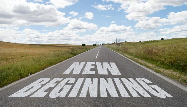 New beginning message written on the road — Stock Photo, Image