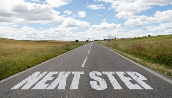Next step message written on the road — Stock Photo, Image