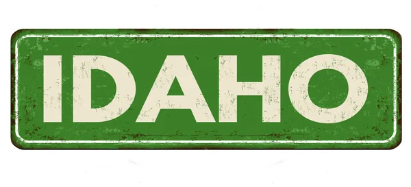 Idaho vintage zardzewiały metal znak — Wektor stockowy
