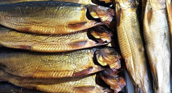Background of smoked fish on sale — Stock Photo, Image