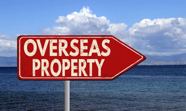 Overseas property metallic vintage sign — Stock Photo, Image