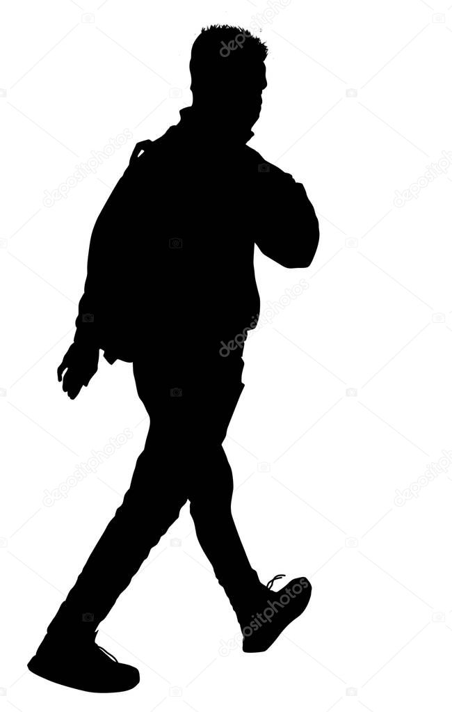 Man silhouette walking with backpack