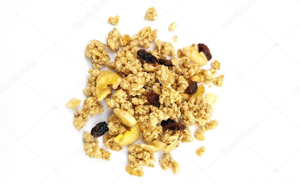 A handful of crunchy granola, muesli  with dried fruit on white background