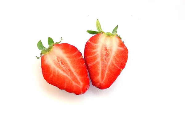 Two slice of half strawberry and leaves — Stock Photo, Image