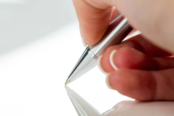 Hand with fountain pen with signature — Stock Photo, Image