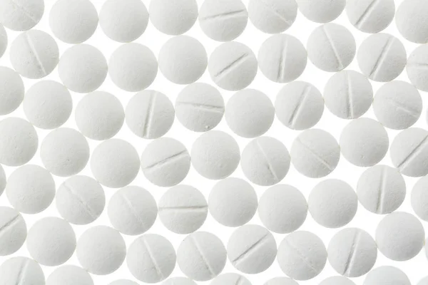 Bílé tablety v hojnosti — Stock fotografie