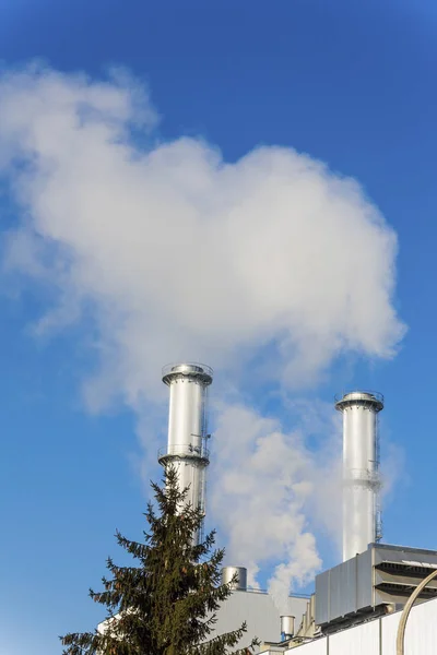 Industrial chimney with tree — Stock Photo, Image