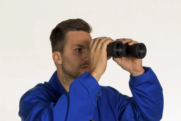 Craftsman with binoculars — Stock Photo, Image