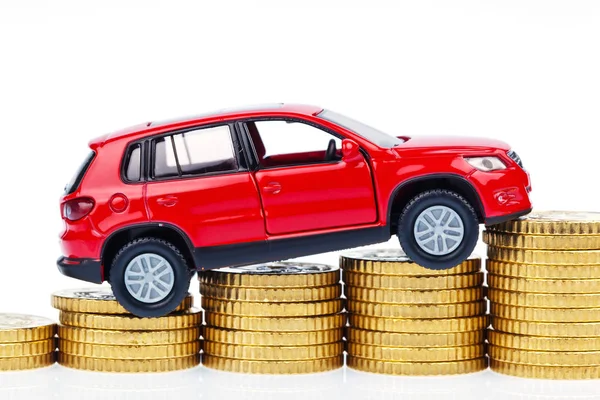 Modellauto und Münzen. Autokosten — Stockfoto