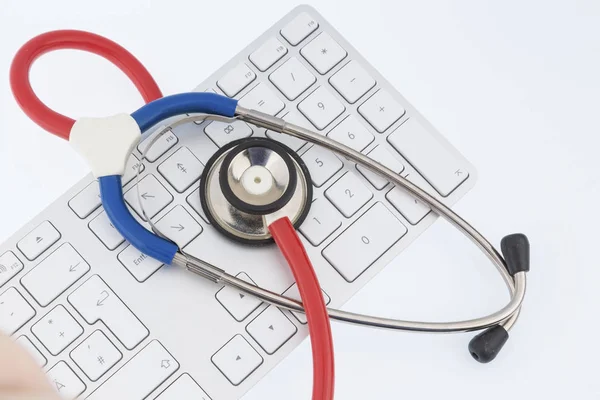 Stethoscope and keyboard of a computer — Stock Photo, Image