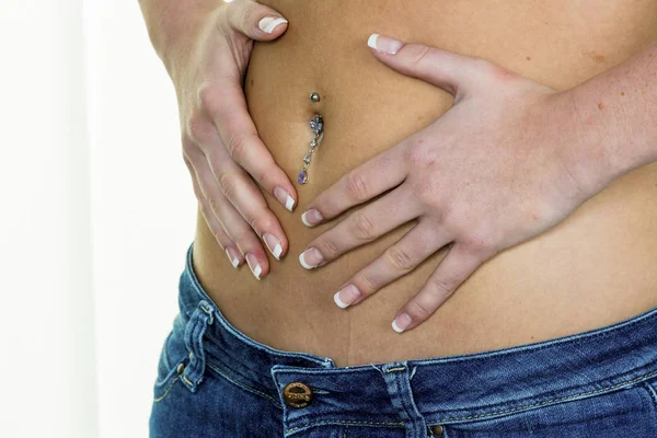 Woman has hands on belly — Stock Photo, Image