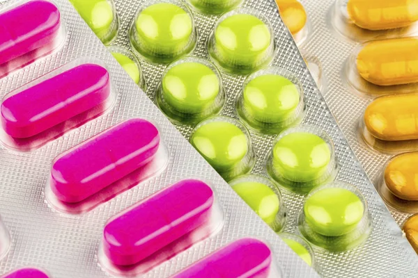 Multicolored tablets in the blister pack, — Stock Photo, Image