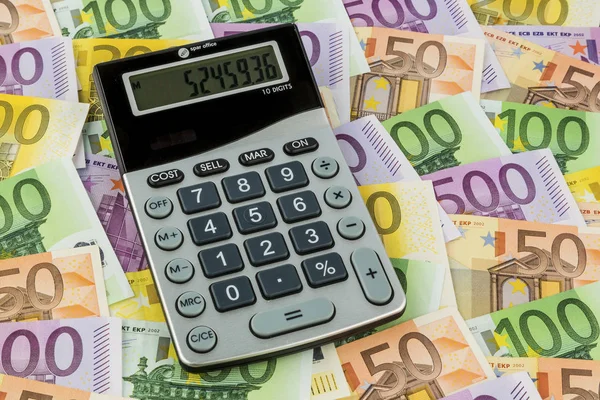 Calculator and euro bills — Stock Photo, Image