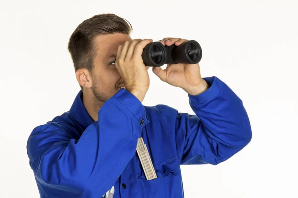 Craftsman with binoculars — Stock Photo, Image