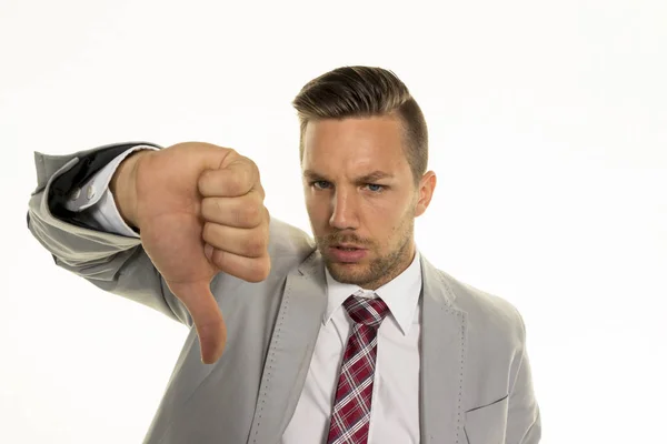 Businessman shows thumbs down — Stock Photo, Image