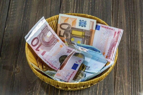 Basket of money from donations — Stock Photo, Image