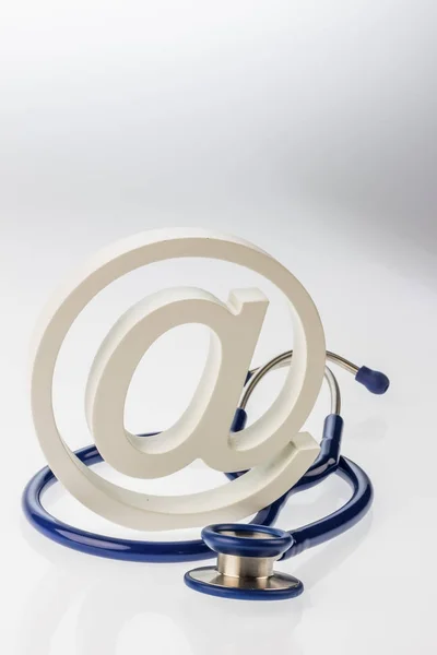 Email sign and stethoscope — Stock Photo, Image