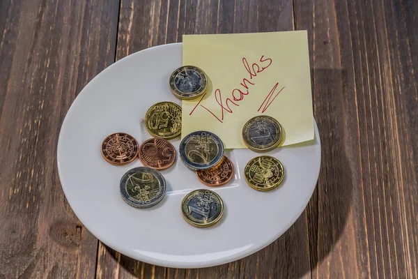 Plate with coins — Stock Photo, Image