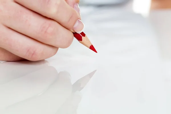 Hand with red pencil — Stock Photo, Image