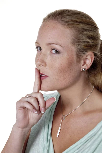 Woman with finger on mouth — Stock Photo, Image