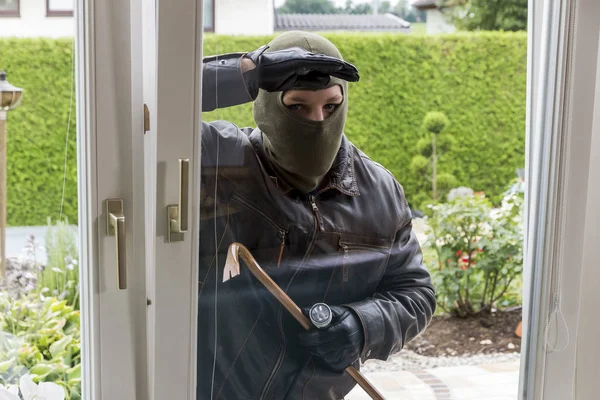 Burglar at a window — Stock Photo, Image