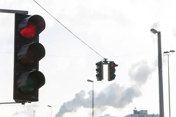 Industrial lot and red traffic light — Stock Photo, Image