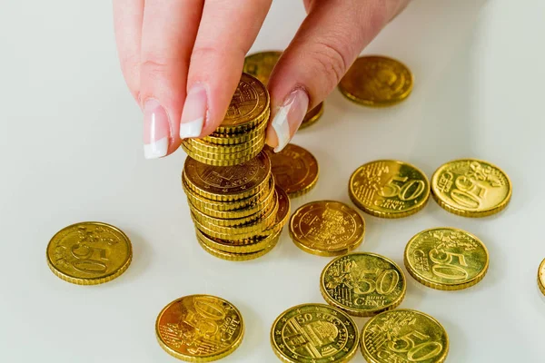 Woman with coin stack while saving money — Stock Photo, Image