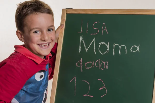 Schoolchild with school blackboard — Stock Photo, Image