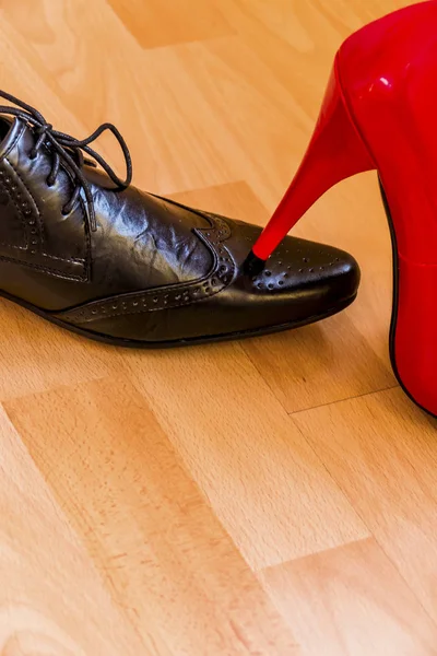 Ladys slipper occurs on a mens shoe — Stock Photo, Image