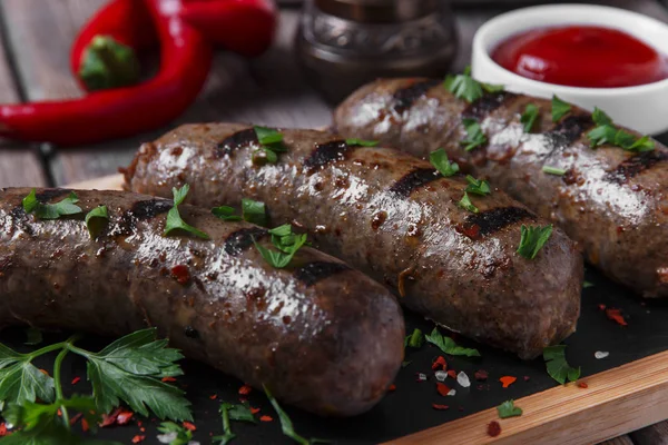 Homemade cooked sausages fried on a grill beef — Stock Photo, Image