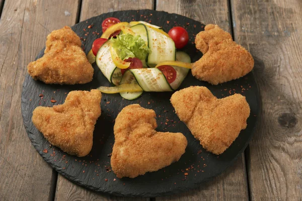 Chicken wings fried in breadcrumbs golden