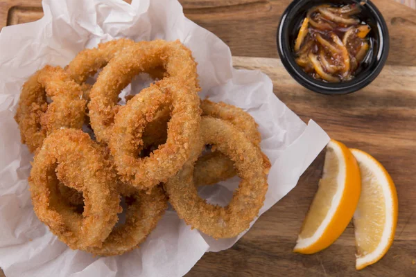 fried squid rings in breaded with lemon