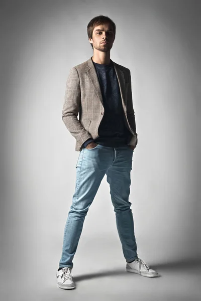 Fashion man model dressed casual posing dramatic in the studio — Stock Photo, Image