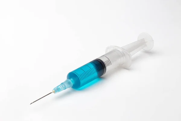 Single syringe in white — Stock Photo, Image