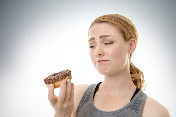 Eating yum doughnut — Stock Photo, Image