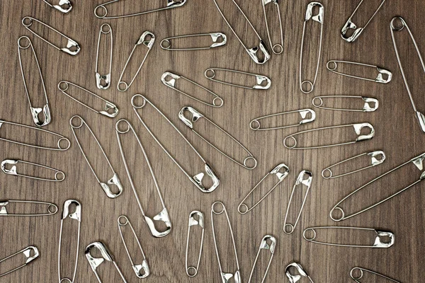 Safety Pins Wooden Background — Stock Photo, Image