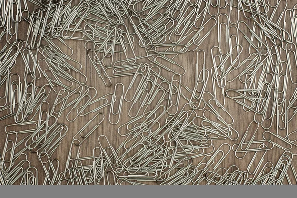 Vele Paperclips Houten Achtergrond — Stockfoto